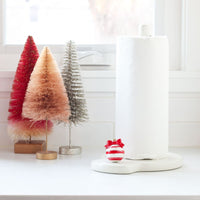 red and white ornament and melamine paper towel holder