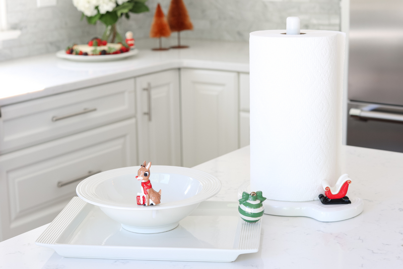 pinstripes melamine paper towel holder and santa sleigh mini and green and white ornament and rudolph the red-nosed reindeer mini in a white kitchen
