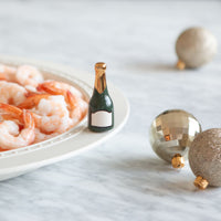 champagne mini and shrimp on a platter